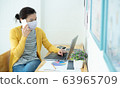Asian beautiful women wearing masks work at home, 63965709