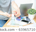 Asian women work at home using notebook, pressing 63965710