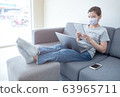 Beautiful Asian women work at home using notebook 63965711