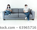 Asian women wearing masks working at home using 63965716