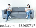Asian women wearing masks working at home using 63965717