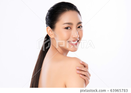Beautiful Young Asian Woman with Clean Fresh Skin. Face care, Facial treatment, Cosmetology, beauty Beautiful Young Asian Woman with Clean Fresh Skin. Face care, Facial treatment, Cosmetology, beauty 63965783