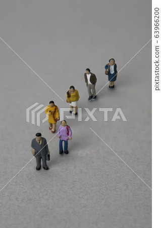 Miniature people standing in line Miniature people standing in line 63966200