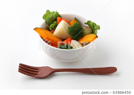 Hot vegetable salad white background 63966450