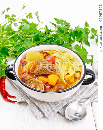 Lagman in bowl on wooden board Lagman in bowl on wooden board 63967398