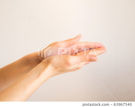 Female hands cleaning with sanitizer gel Female hands cleaning with sanitizer gel 63967540