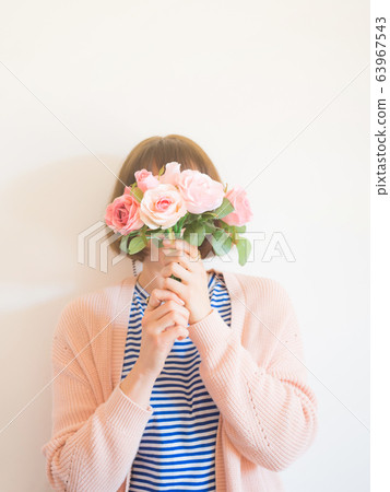 Faceless female portrait with flowers covering her face Faceless female portrait with flowers covering her face 63967543