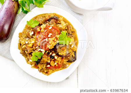 Rice with vegetables and chicken in plate 63967634