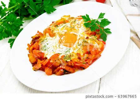 Scrambled eggs with vegetables in plate Scrambled eggs with vegetables in plate 63967665