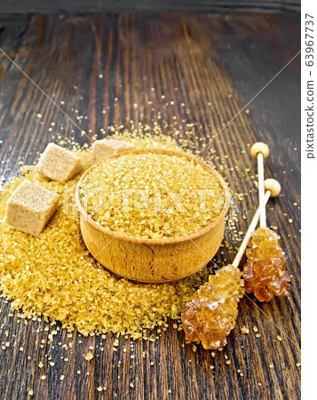 Sugar brown in bowl and crystalline on board Sugar brown in bowl and crystalline on board 63967737