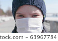 Guy in a protective mask on the street. Prevention and protection of health and life safety. Coronavirus N1H1,covid-19, a pandemic in the world. 63967784