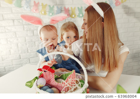 Mother with daughter in a kitchen prepare to easter Mother with daughter in a kitchen prepare to easter 63968004
