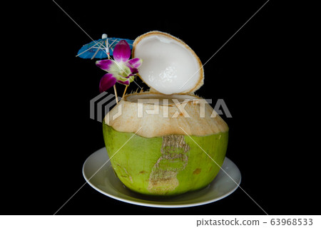 coconut juice on black background coconut juice on black background 63968533