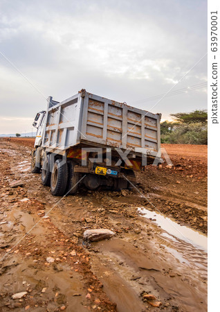 Truck stuck. The rear wheels are muddy. Mud road Truck stuck. The rear wheels are muddy. Mud road 63970001