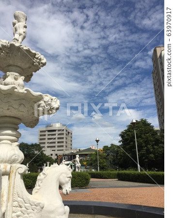 Cool blue sky background and fountain Cool blue sky background and fountain 63970917
