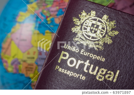 Portuguese international European Union foreign passport. On the background of the earth. Customs concept. 63971897