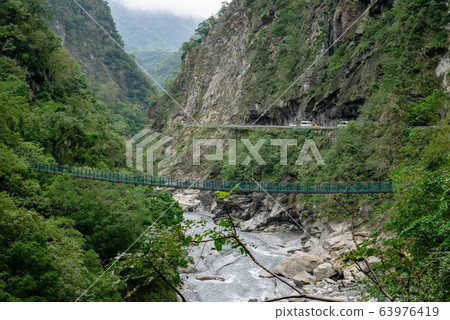 The view of green bridge and river at Taroko national park (Taroko gorge scenic area) in Taiwan. 63976419