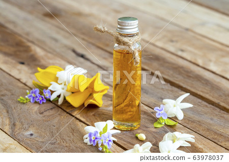 natural herbal oils extract flower jasmine smells scents aroma with yellow flowers ylang ylang ,purple flowers 63978037