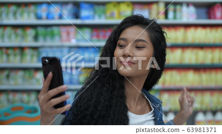 Shopping concepts. Beautiful girls are enjoying Shopping concepts. Beautiful girls are enjoying 63981371