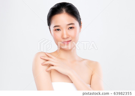 Beautiful Young Asian Woman with Clean Fresh Skin. Face care, Facial treatment, Cosmetology, beauty Beautiful Young Asian Woman with Clean Fresh Skin. Face care, Facial treatment, Cosmetology, beauty 63982355