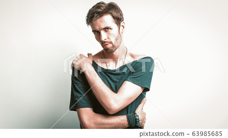 Macho with Muscular Build Posing On White Macho with Muscular Build Posing On White 63985685