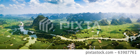 Rural Chinese landscape of limestone rocks and 63987761