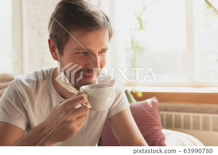 Young man studying at home during online courses for financist, economist, managers Young man studying at home during online courses for financist, economist, managers 63990780