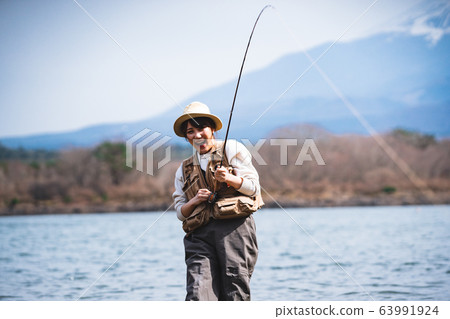 Fishing woman 63991924
