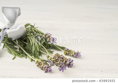 Levander flower bouquet on wooden table with copy Levander flower bouquet on wooden table with copy 63991935