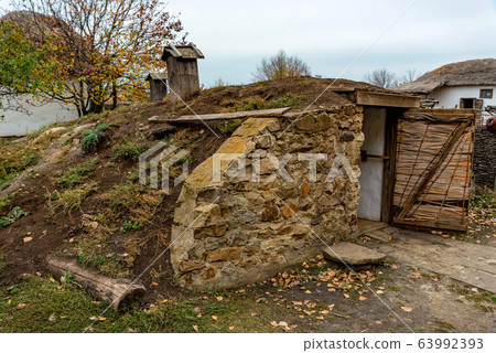 Outside view of small traditional cossack cellar and yard 63992393