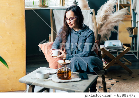woman tea cozy interior woman tea cozy interior 63992472