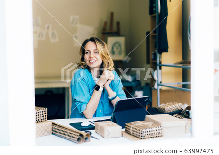 .happy young woman at workplace .happy young woman at workplace 63992475