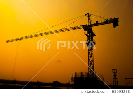 The construction crane on sunset 63993288