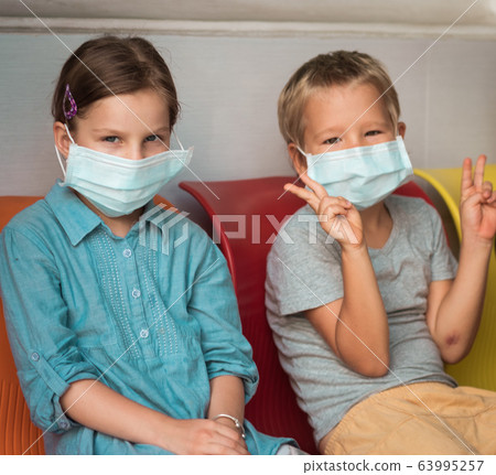 Kids wearing facial disposable mask. Virus Kids wearing facial disposable mask. Virus 63995257