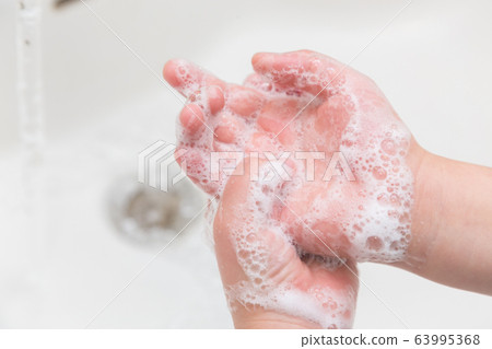 A child washing hands A child washing hands 63995368