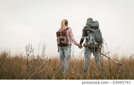 Couple Of Treveler Standing Outdoors 63995741