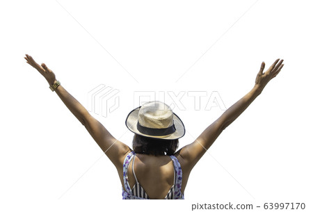Isolated The image behind Asian women raise their arms and wear a hat on a white background with clipping path. Isolated The image behind Asian women raise their arms and wear a hat on a white background with clipping path. 63997170