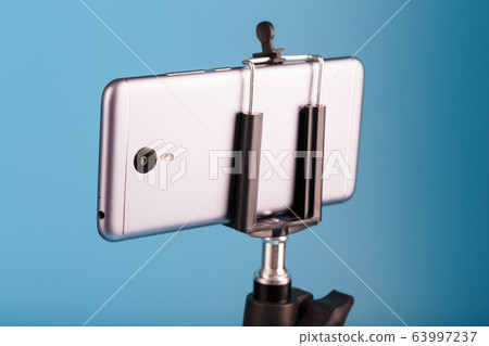 Smartphone on a tripod as a photo-video camera on Smartphone on a tripod as a photo-video camera on 63997237