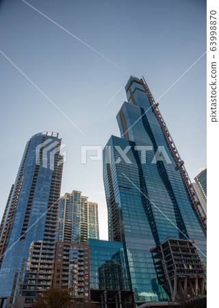 Skyscrapers along the river in Chicago Skyscrapers along the river in Chicago 63998870