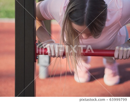 Woman Doing Push Ups 63999799