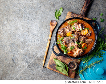 Beef ribs Bourguignon. Beef ribs stewed with carrot, onion in red wine. France dish Beef ribs Bourguignon. Beef ribs stewed with carrot, onion in red wine. France dish 64002215