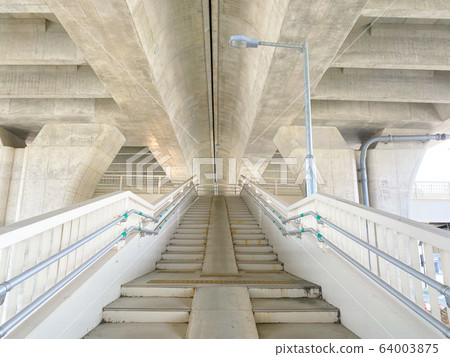 Pedestrian bridge under the bridge overpass. Pedestrian bridge under the bridge overpass. 64003875