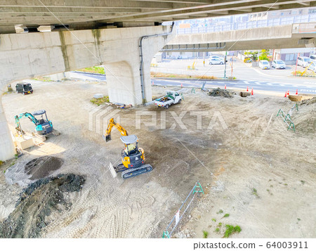 Construction site under a bridge overpass. Construction site under a bridge overpass. 64003911