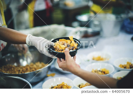 Food donation to hungry people, poor hands waiting Food donation to hungry people, poor hands waiting 64005670