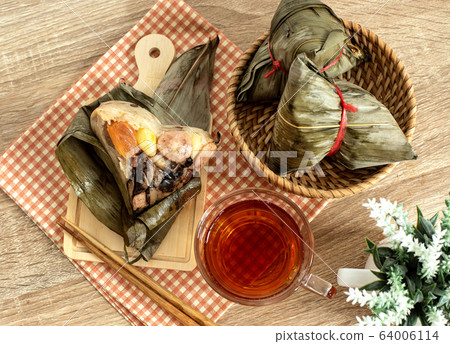 Close up Zongzi or rice dumpling on the wooden 64006114