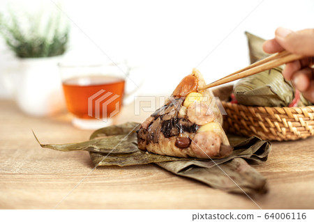 Close up Zongzi or rice dumpling on the wooden 64006116