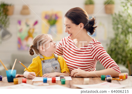 Happy family painting together. Happy family painting together. 64006215