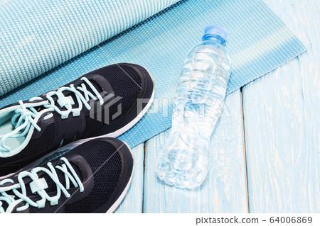 Yoga Mat, sports shoes, water bottle concept of - Stock Photo [64006869] -  PIXTA