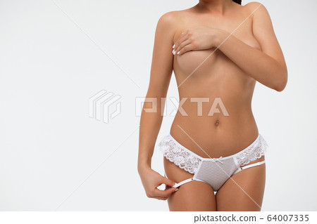 Crop sexy female covering breast touching lingerie 64007335