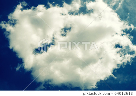 Incredibly wonderful lush cumulus clouds against a Incredibly wonderful lush cumulus clouds against a 64012618